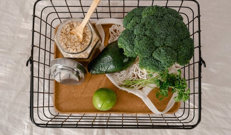 A basket of fresh produce and oats promoting a healthy and sustainable lifestyle.